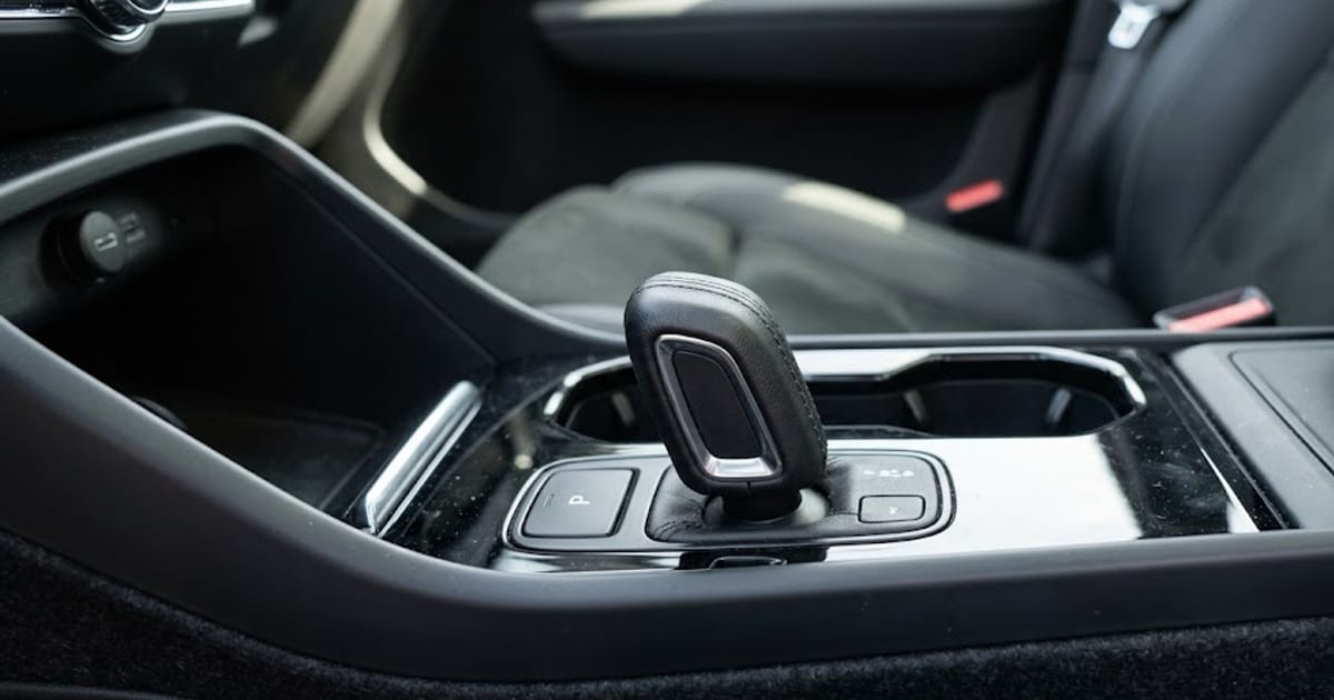 A shift-by-wire gear selector in the centre console of a modern SUV