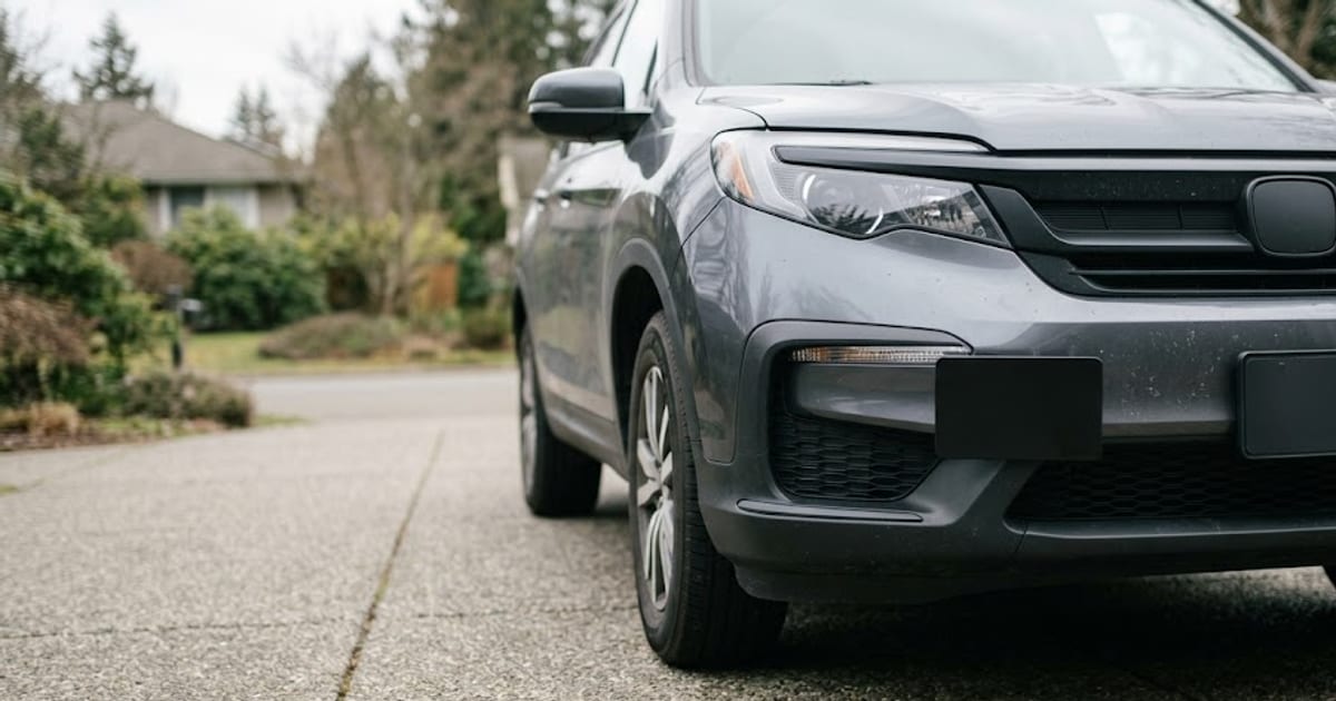 The front of an SUV with the adaptive cruise radar sensor in the lower grille