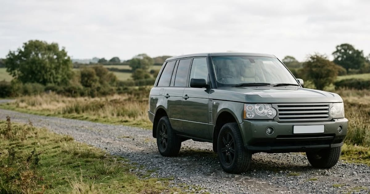 A full-size luxury SUV raised to off-road height on air suspension